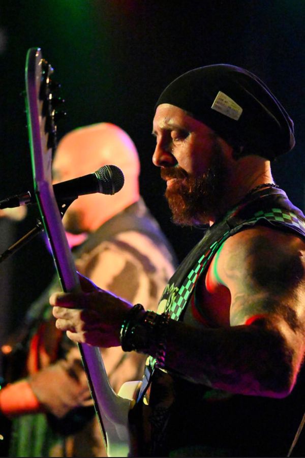Bassist in profile playing on stage